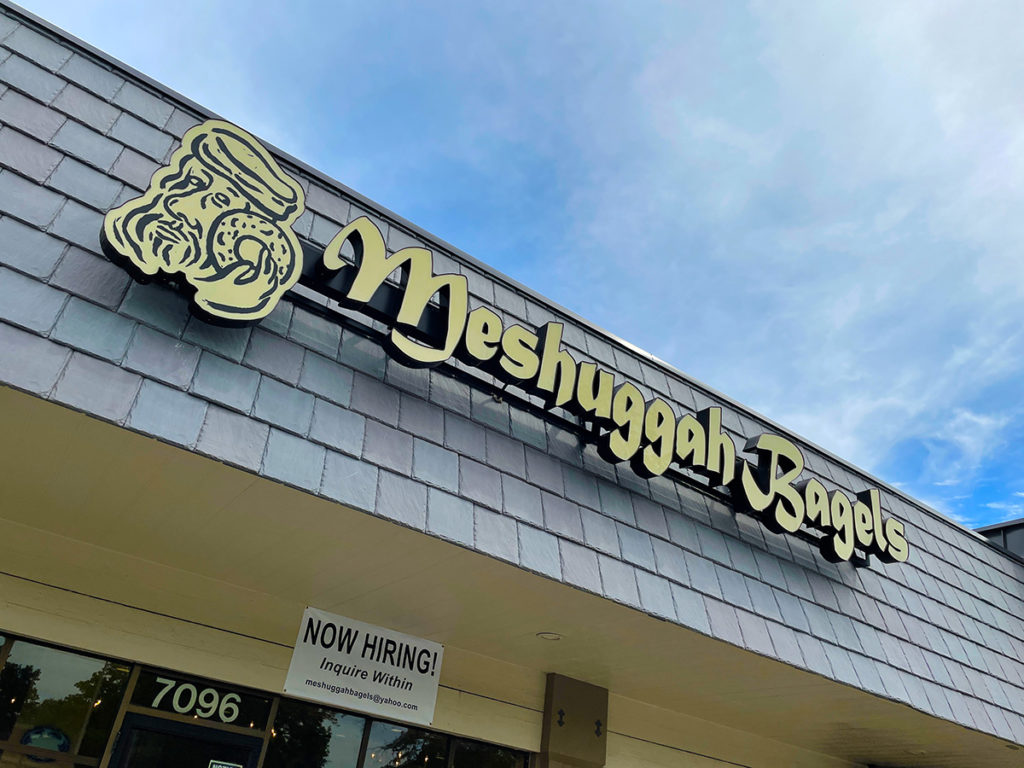 Meshuggah Bagels sign on outside of building
